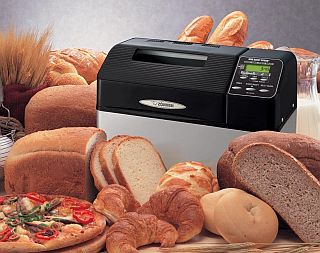 Image shows Zojirushi BB-CEC20 bread maker and many bread loaves